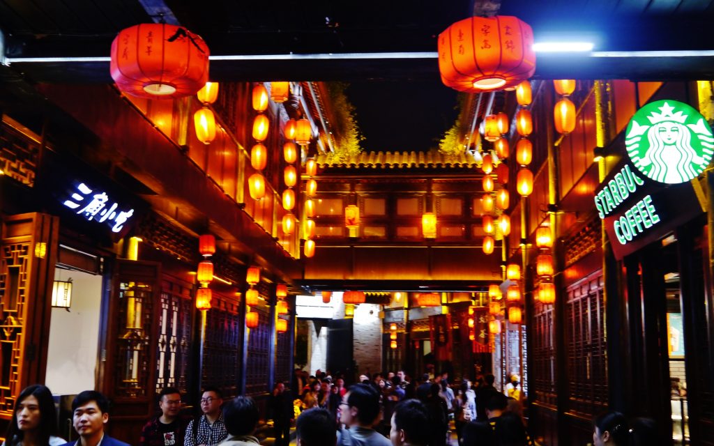 Lantern-lit traditional shopfronts on Jinli Ancient Street in Chengdu at night