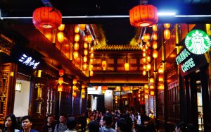 Lantern-lit traditional shopfronts on Jinli Ancient Street in Chengdu at night