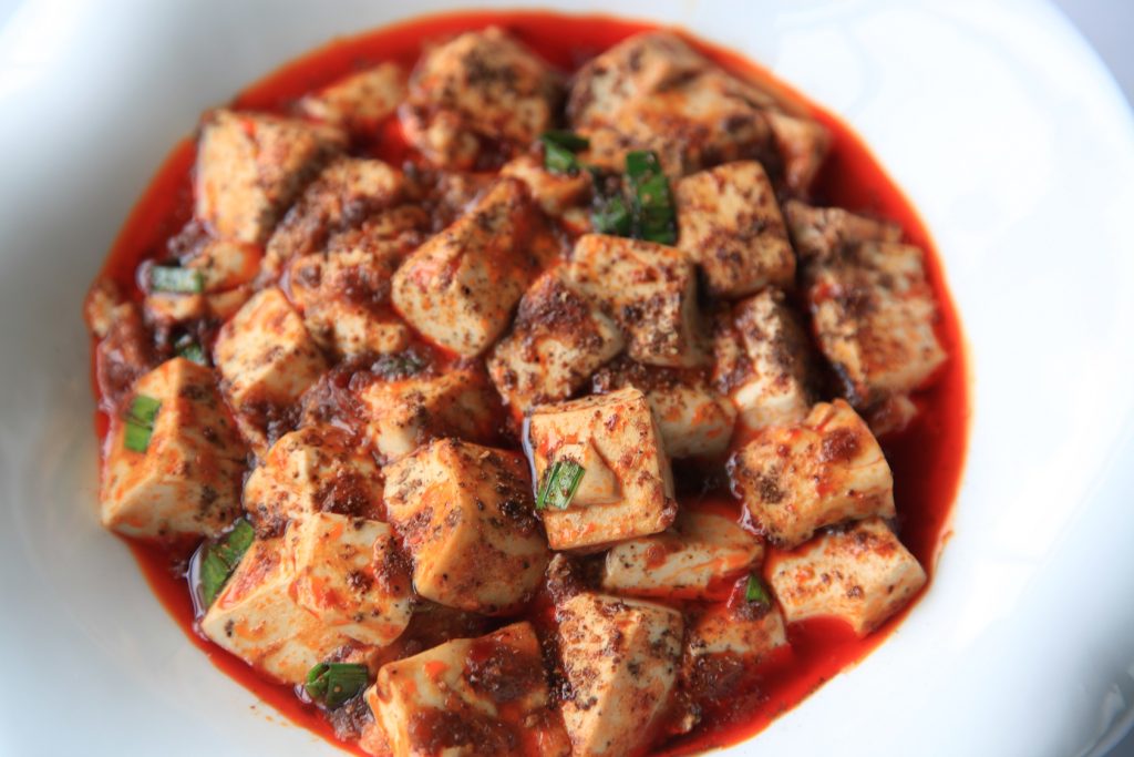 Bowl of authentic Sichuan-style mapo tofu with chilli oil and minced meat
