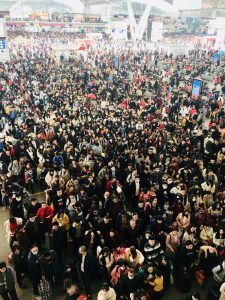 Crowded waiting hall at Guangzhou South Railway Station during peak travel