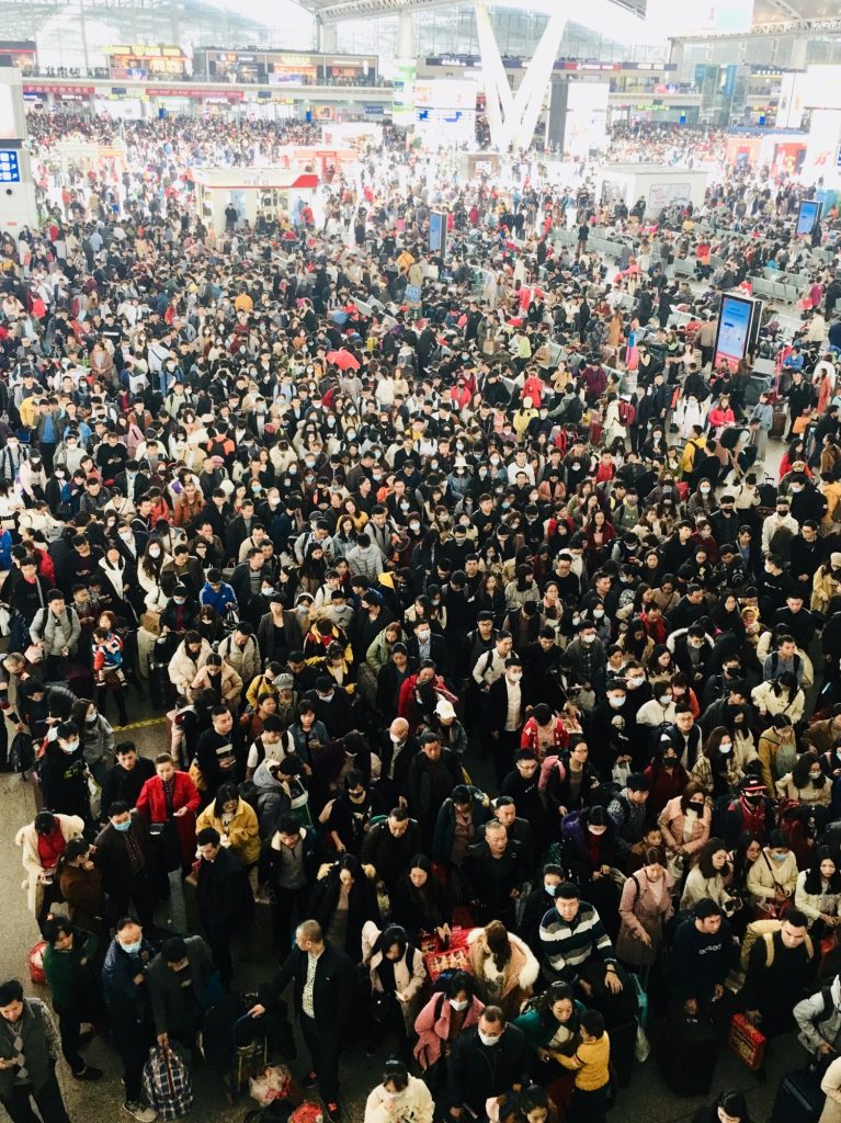 Crowded waiting hall at Guangzhou South Railway Station during peak travel