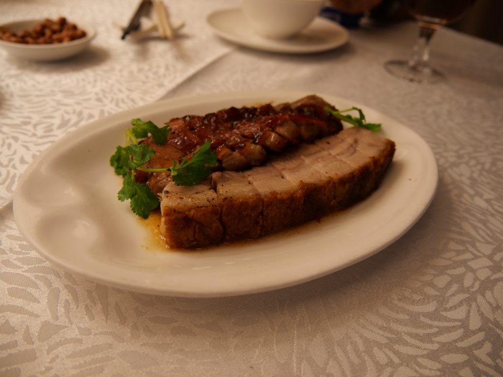 Display of Cantonese char siu barbecue pork and siu yuk roast pork in a Hong Kong siu mei shop