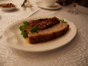 Display of Cantonese char siu barbecue pork and siu yuk roast pork in a Hong Kong siu mei shop