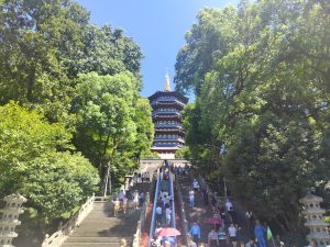 Leifeng Pagoda rising above trees near West Lake in Hangzhou