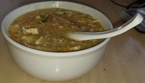 Bowl of Hangzhou Sister Song fish soup with egg ribbons and flaked fish