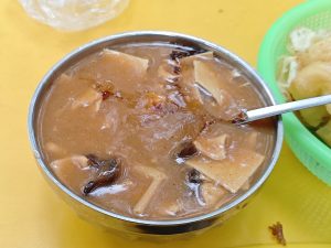 Bowl of Henan-style hulatang pepper soup with thick broth and toppings
