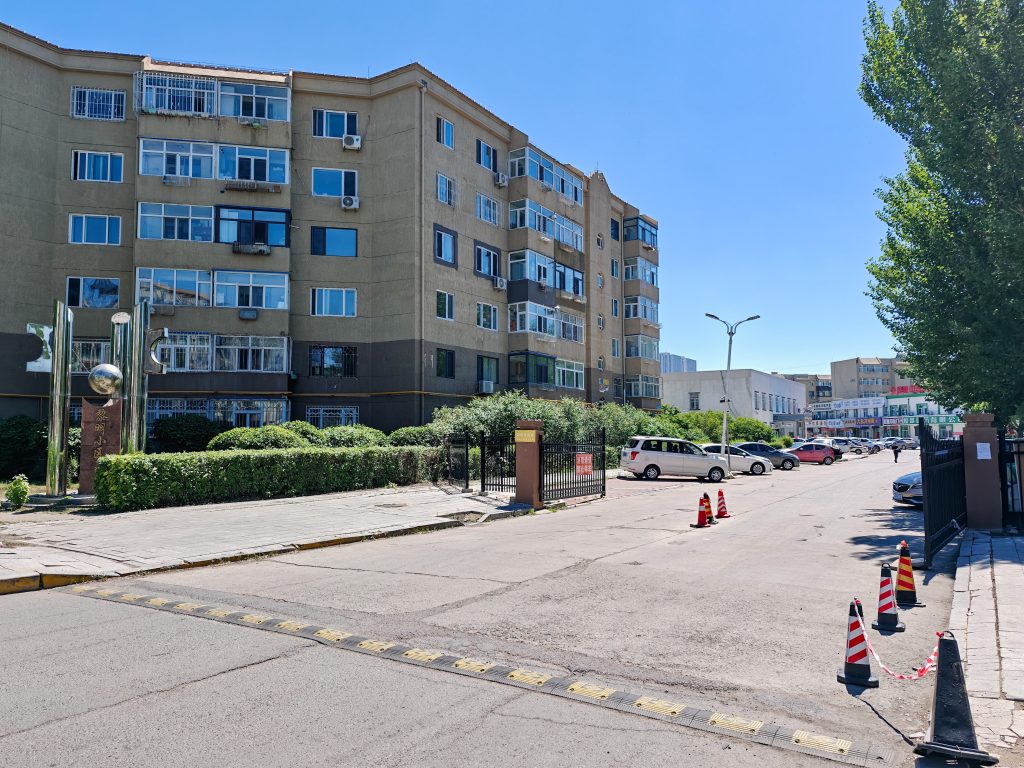 Northeast gate of a Chinese residential compound (xiaoqu) with entrance structures