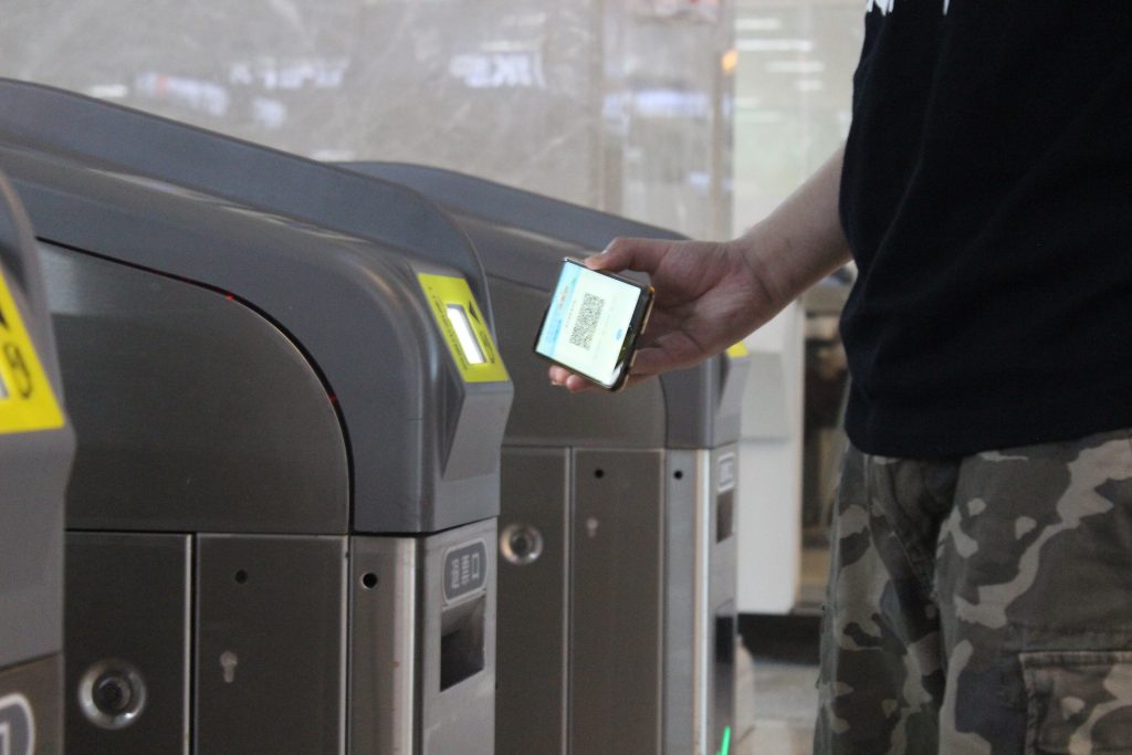Passengers using QR codes at a Wuhan Metro gate