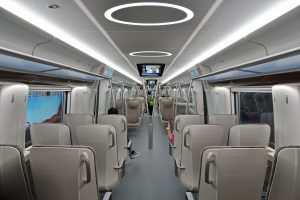 Airport express train doors open at a modern elevated station platform