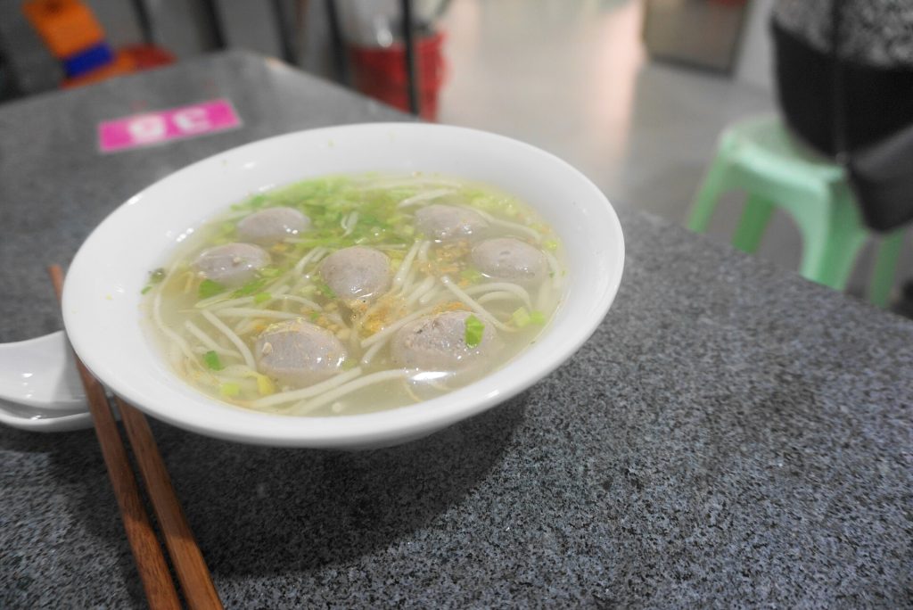 Bowl of Chaoshan beef ball soup with clear broth and greens