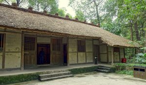 Traditional thatched cottage buildings among trees at Chengdu’s Du Fu Thatched Cottage