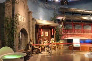 Chengdu city street with tea house seating and tree shade