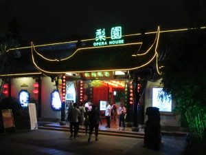 Chengdu street scene with tea house seating and autumn trees