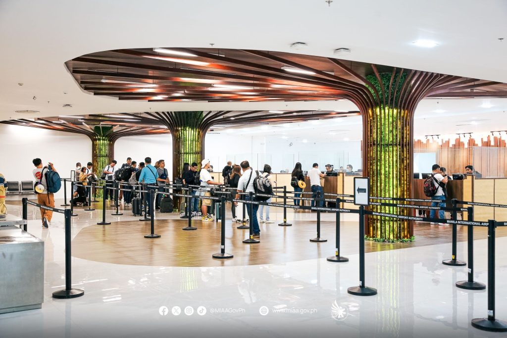 Airport immigration arrival hall with passport control lanes for international travellers