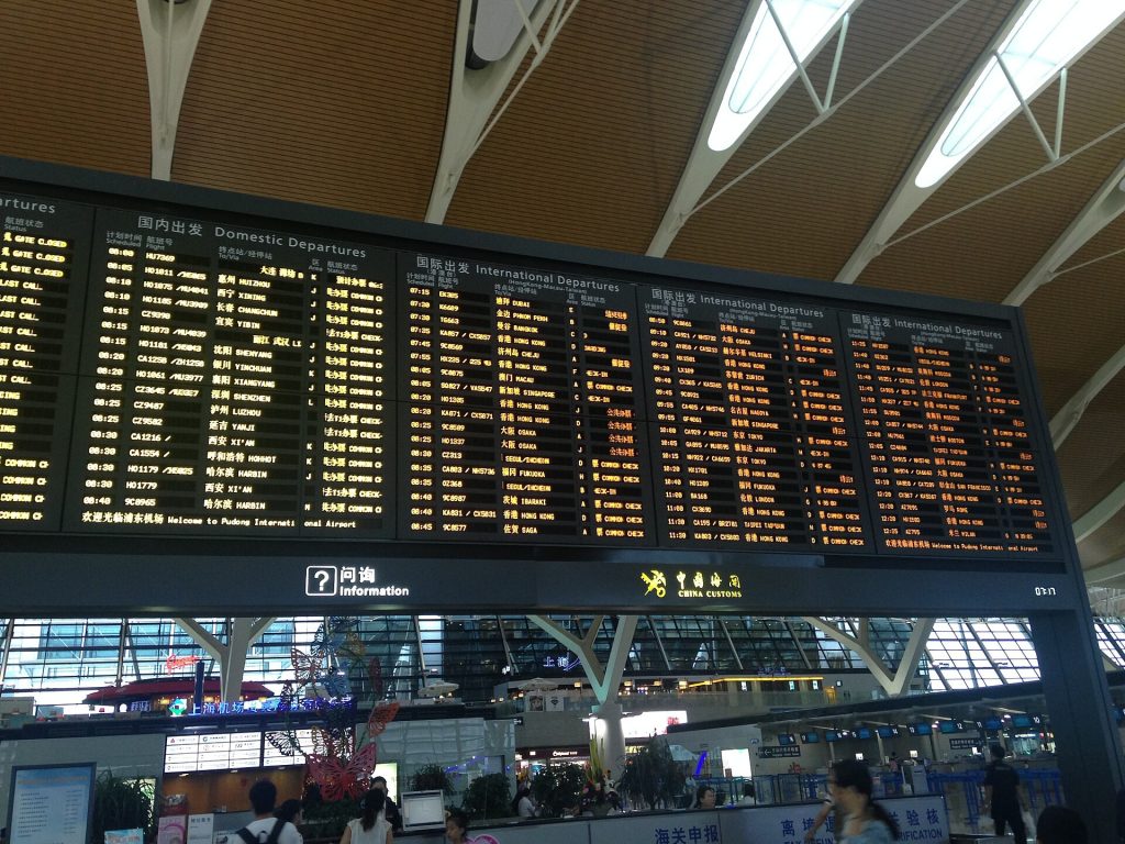 International airport transit hall clocks and departure boards in China