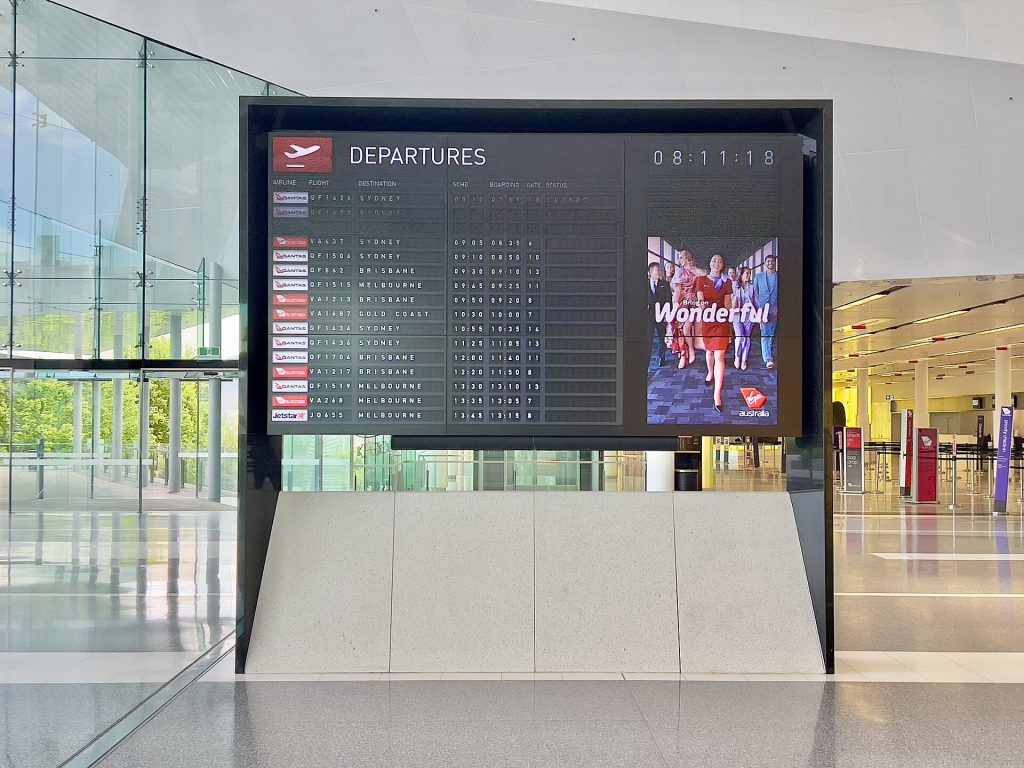 Airport departure board showing international connecting flights