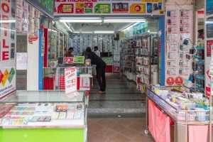 Mobile phone shop counter with SIM packs and passport on the desk