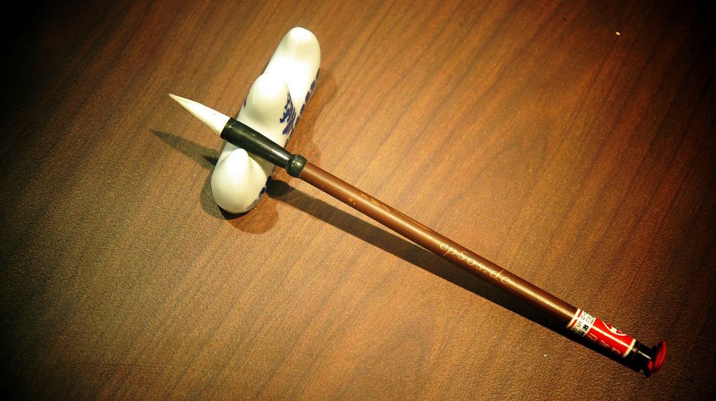 Traditional Chinese calligraphy brushes with bamboo handles ready for writing
