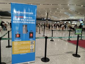 Portable power banks and cables laid out in an airport security tray