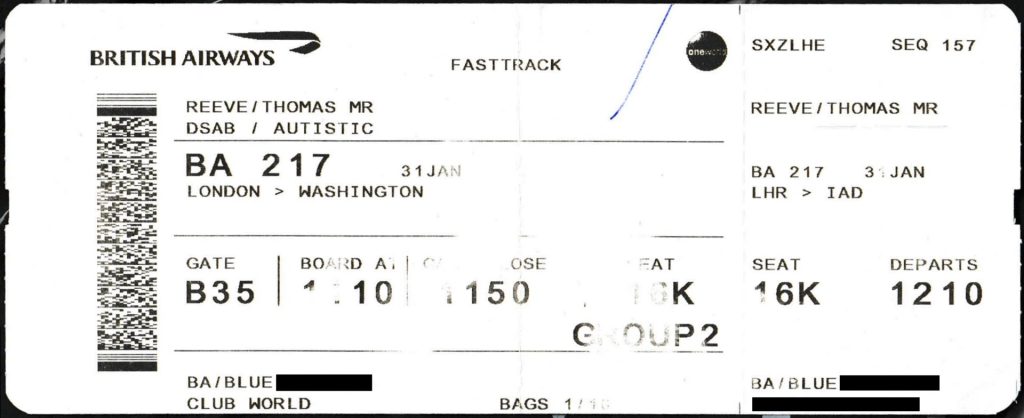 Boarding pass and passport on an airport tray at check-in