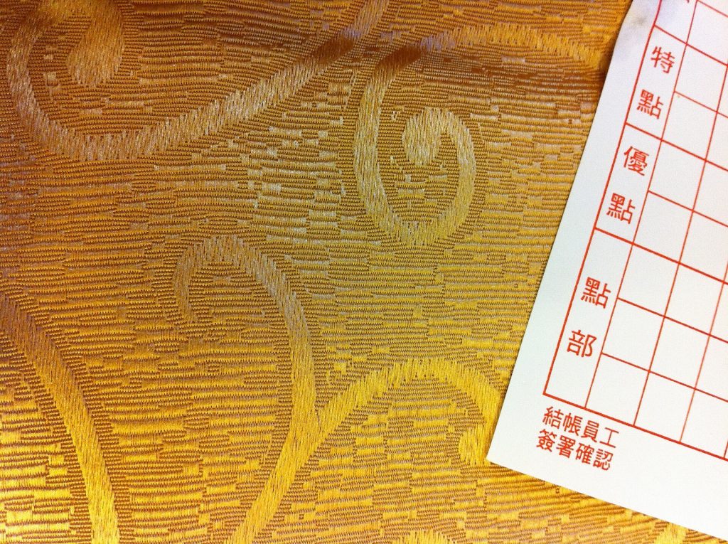 Friends splitting a restaurant bill with QR codes on phones