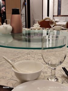 Round banquet table with lazy Susan and place settings