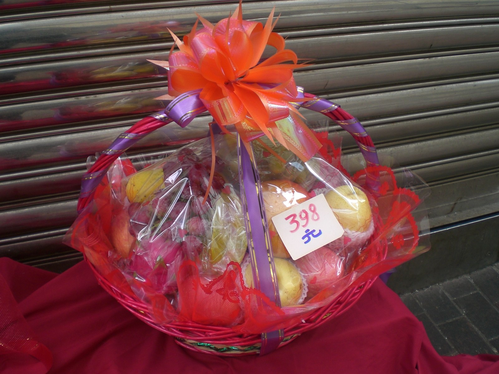 Wrapped gift box and fruit basket on a Chinese living room table