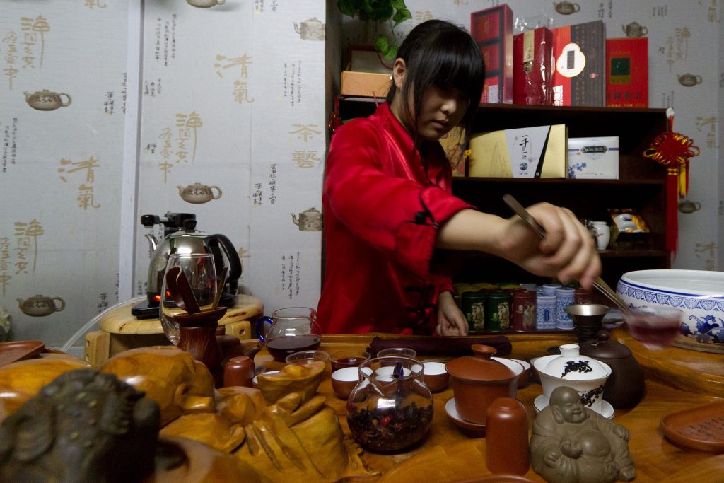 Gongfu tea setup with teapot, cups, and tea tray ready for tasting