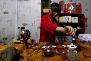 Gongfu tea setup with teapot, cups, and tea tray ready for tasting
