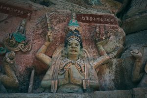 Painted Song-dynasty Wisdom King figure carved into the cliff at Baodingshan, Dazu Rock Carvings, Chongqing
