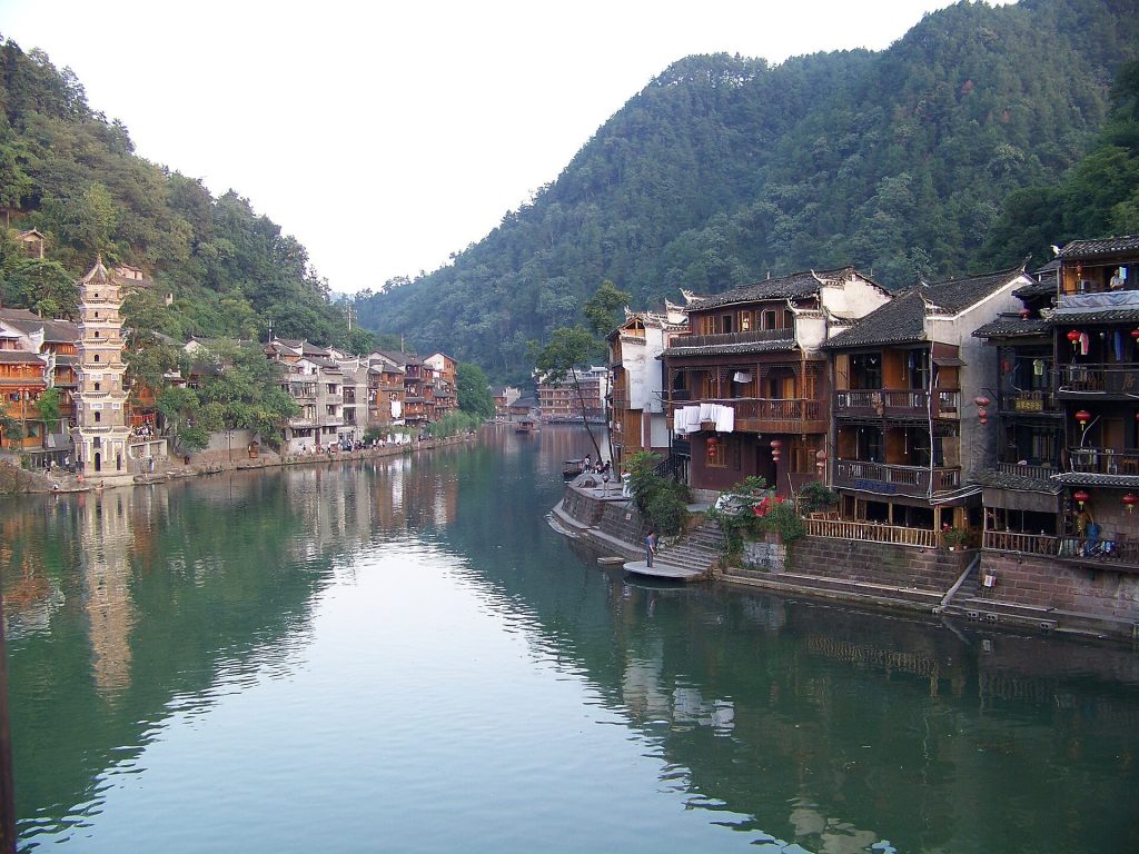 Wooden riverside houses along the Tuojiang River in Fenghuang Ancient Town, Hunan
