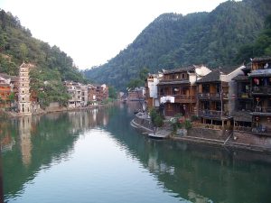 Wooden riverside houses along the Tuojiang River in Fenghuang Ancient Town, Hunan