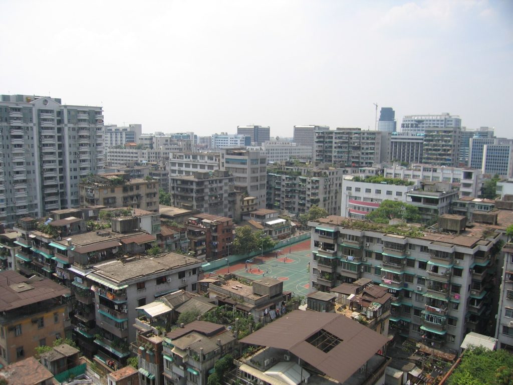 Guangzhou skyline with modern towers along the Pearl River under a bright sky
