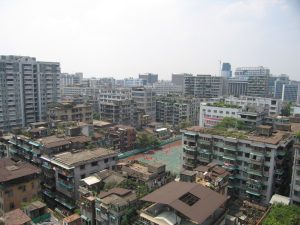Guangzhou skyline with modern towers along the Pearl River under a bright sky