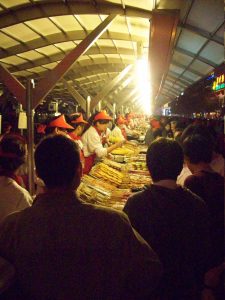 Food stalls and evening crowds at Donghuamen Night Market in Beijing