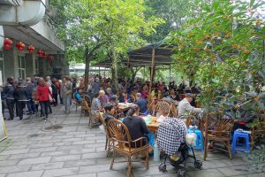 Quiet Chengdu teahouse street scene in soft evening light
