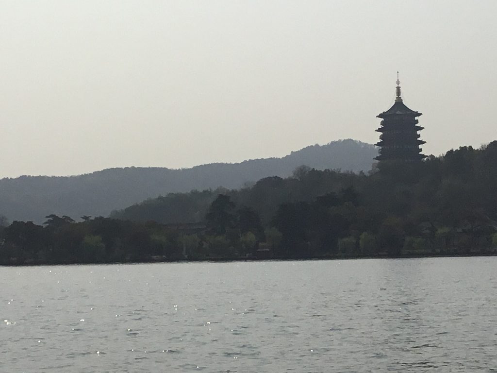 West Lake Hangzhou evening lights reflected on calm water