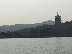 West Lake Hangzhou evening lights reflected on calm water