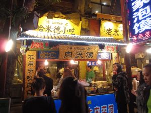Rou jia mo Chinese flatbread sandwich filled with chopped stewed meat