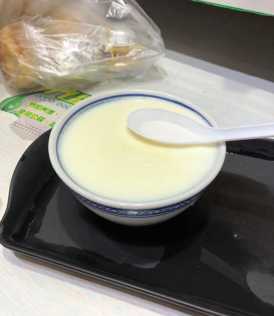 Bowl of Cantonese double-skin milk dessert with a smooth creamy surface