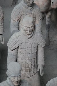 Rows of Terracotta Warriors in Pit 1 near Xi'an under museum lighting