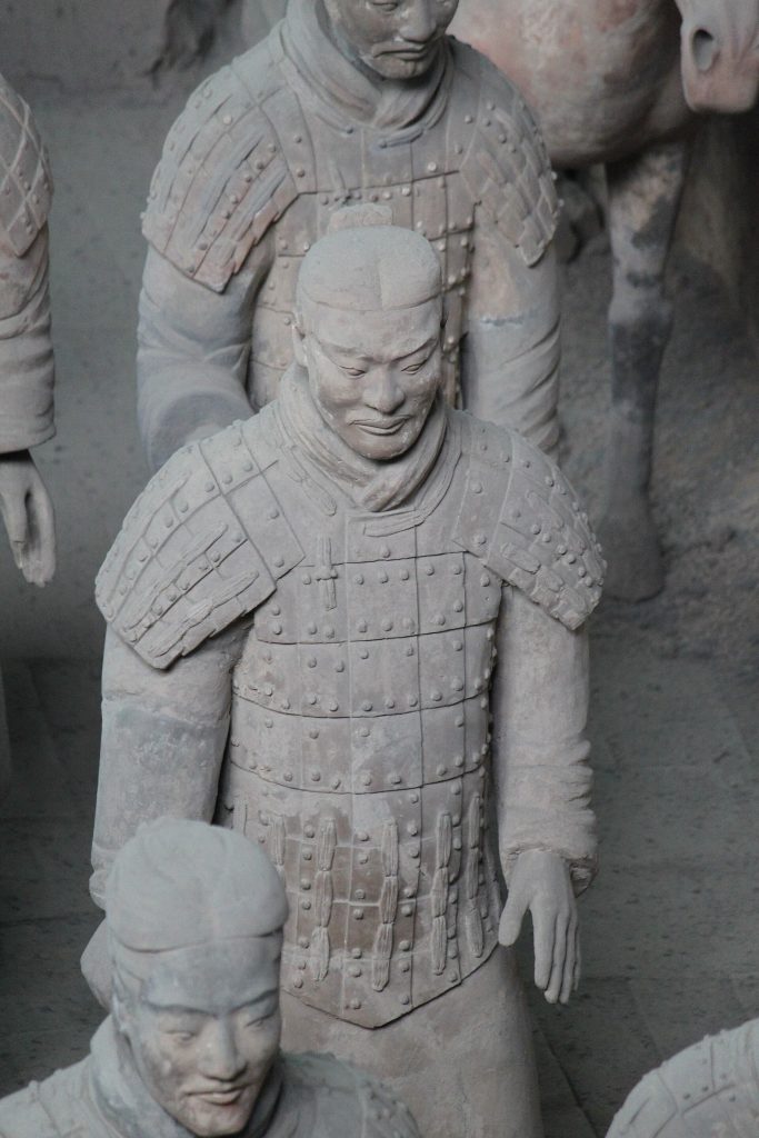 Rows of Terracotta Warriors in Pit 1 near Xi'an under museum lighting