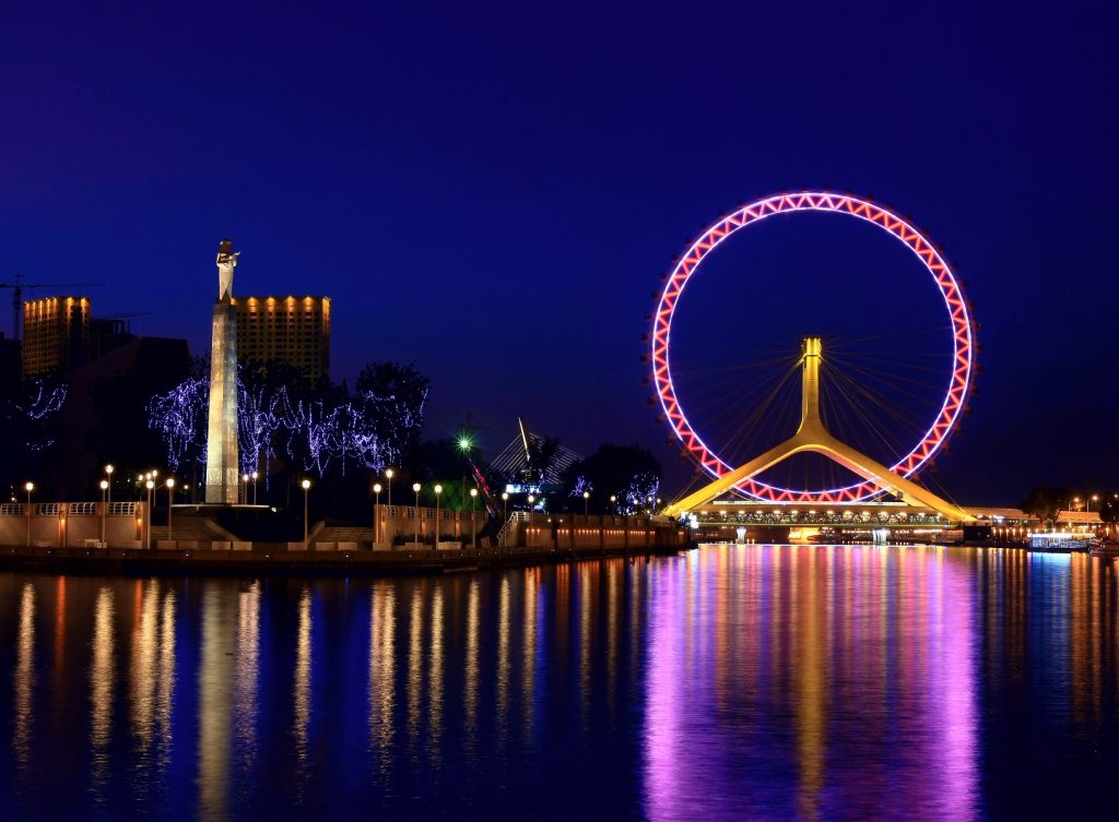 Tianjin eye Ferris wheel and Haihe riverfront under autumn sky
