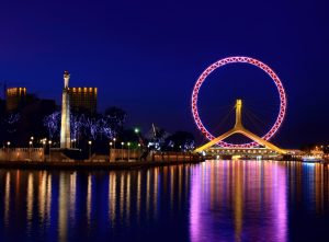 Tianjin eye Ferris wheel and Haihe riverfront under autumn sky
