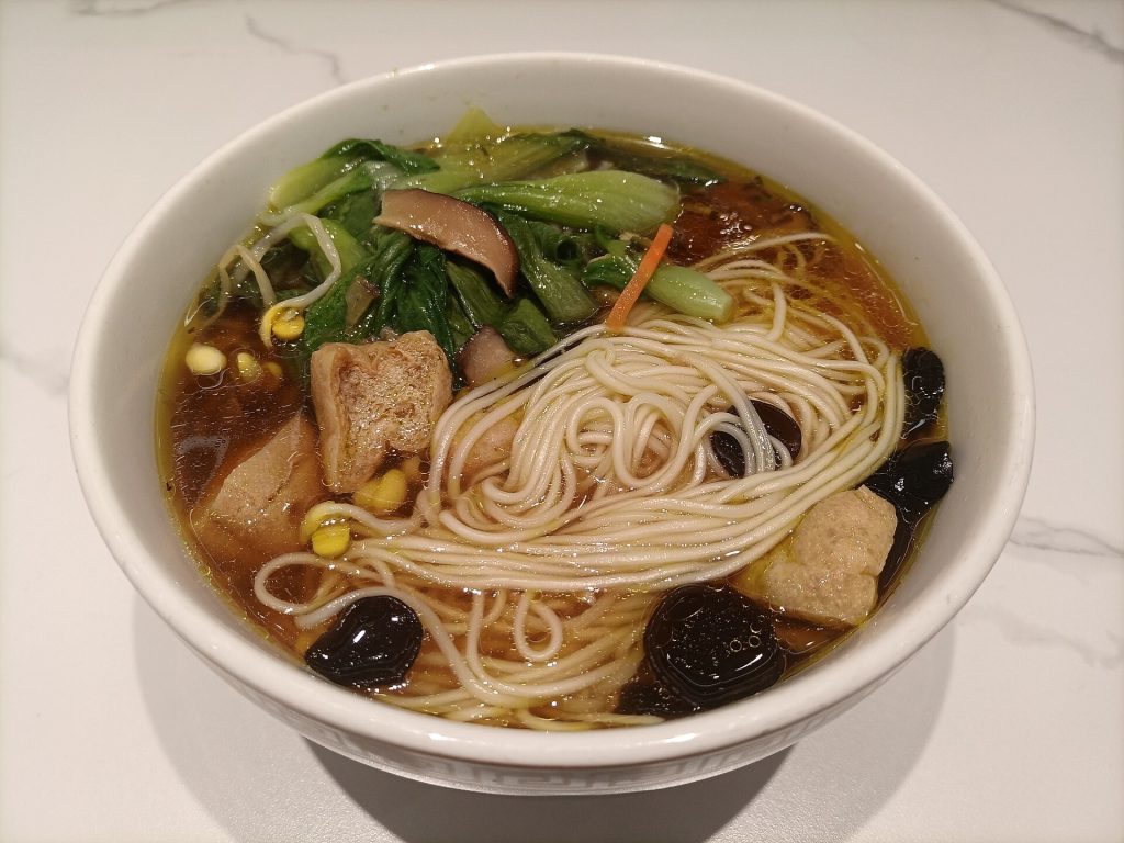Assortment of Chinese vegetarian dishes on a restaurant table